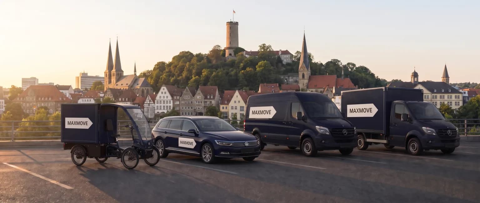 Maxmove courier van in front of the Bielefeld skyline